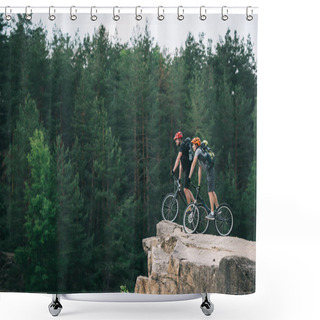 Personality  Side View Of Young Trial Bikers Standing On Rocky Cliff With Blurred Pine Forest On Background And Looking At Side Shower Curtains