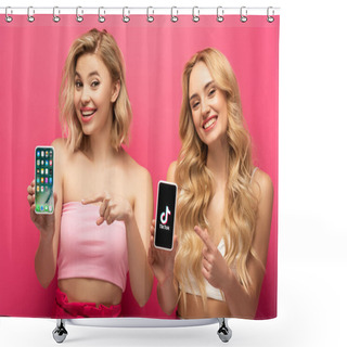Personality  KYIV, UKRAINE - MARCH 10, 2020: Smiling Blonde Friends Pointing On Smartphones With Iphone Screen And TikTok App On Pink Background Shower Curtains