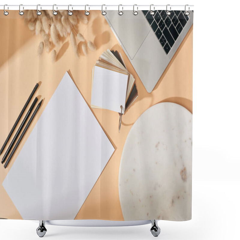 Personality  top view of sheet of paper, pens, marble board, colors samples, lagurus spikelets and laptop on beige background shower curtains