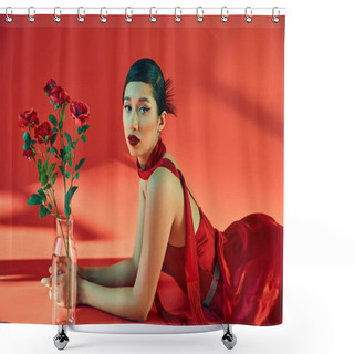 Personality  Spring Fashion Concept, Young And Elegant Asian Woman With Bold Makeup, In Neckerchief And Dress Lying Near Glass Vase With Roses And Looking At Camera On Red Background With Lighting Shower Curtains