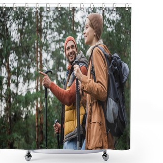 Personality  Happy Man Pointing Away With Finger While Looking At Girlfriend With Hiking Sticks In Forest  Shower Curtains