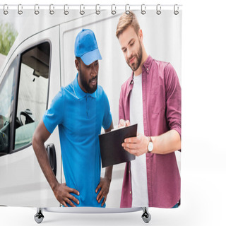 Personality  Multicultural Courier And Client Looking At Clipboard Near Van Shower Curtains