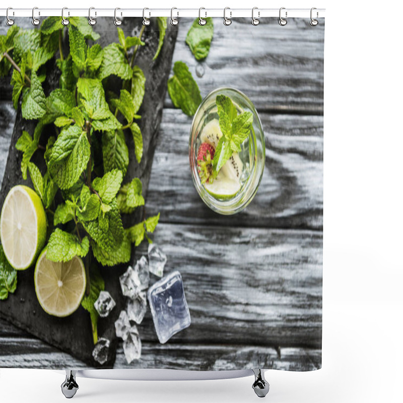 Personality  top view of glass with fresh cold strawberry and kiwi mojito on wooden table  shower curtains
