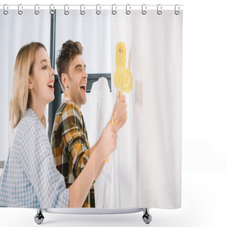 Personality  Happy Young Couple Painting White Wall In Yellow With Paint Rollers Shower Curtains