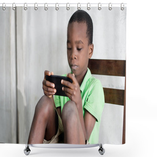 Personality  A Child Sitting On A Chair Is Playing Games In A Mobile Phone. Shower Curtains