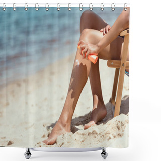 Personality  Cropped Image Of Woman Applying Sunscreen Lotion On Legs While Sitting On Deck Chair On Sandy Beach  Shower Curtains