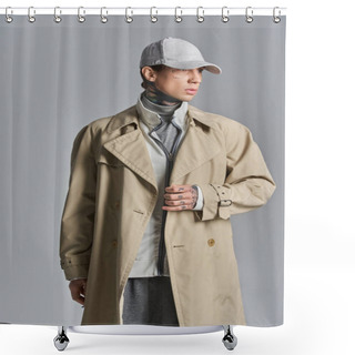 Personality  A Young, Tattooed Man Dons A Stylish Trench Coat And Hat, Exuding A Mysterious And Urban Vibe In A Studio Setting. Shower Curtains