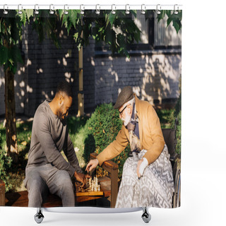 Personality  Senior Disabled Man In Wheelchair And African American Nurse Playing Chess Together On Street Shower Curtains