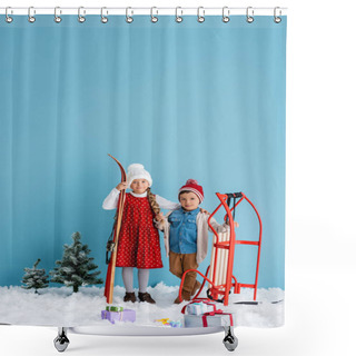 Personality  Child In Winter Outfit Holding Skis And Hugging Boy Standing Near Sleight Isolated On Blue  Shower Curtains
