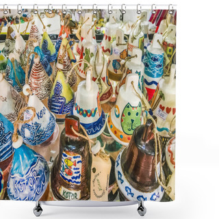 Personality  Kotor, Montenegro - August 24, 2017:  Selection Of Souvenirs From The Old Town Of Kotor, Montenegro. Souvenir Trade - Various Bells With Kotor Inscriptions And Beautiful Drawings. Shower Curtains