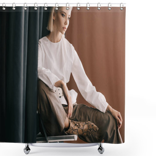 Personality  Stylish Blonde Woman In White Blouse Sitting On Chair Near Curtain On Brown Shower Curtains