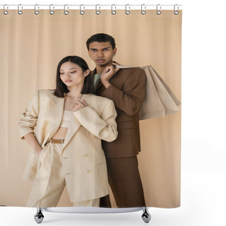 Personality  African American Man With Shopping Bags Looking At Camera Near Asian Woman In Pantsuit Isolated On Beige Shower Curtains