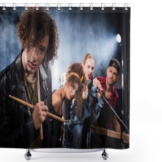 Personality  KYIV, UKRAINE - AUGUST 25, 2020: Curly Drummer With Drumsticks Looking At Camera With Smoke And Blurred People On Background Shower Curtains