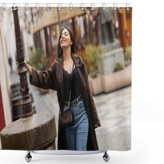 Personality  Trendy Brunette Woman In Coat Touching Lamppost And Laughing On Street In Park Shower Curtains