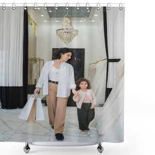Personality  Happy Middle Eastern Woman With Brunette Hair In Beige Pants With White Shirt Holding Shopping Bags While Walking With Little Daughter Near Wedding Dresses In Bridal Salon, Modern Bride, Mother Shower Curtains