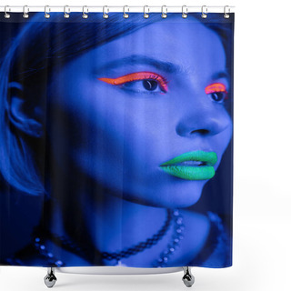 Personality  Close Up Portrait Of Woman With Vibrant Makeup Looking Away In Neon Light On Dark Blue Background Shower Curtains
