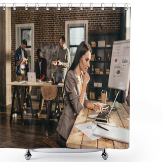 Personality  Pensive Business Woman Sitting At Desk With Laptop And Working On Project At Loft Office With Colleagues On Background Shower Curtains