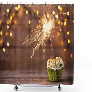 Personality  Cupcake With Sparkler On Old Wooden Background Shower Curtains