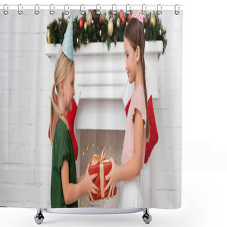 Personality  Side View Of Kid Holding Gift Box Near Friend In Party Cap And Christmas Decor On Fireplace, Banner  Shower Curtains
