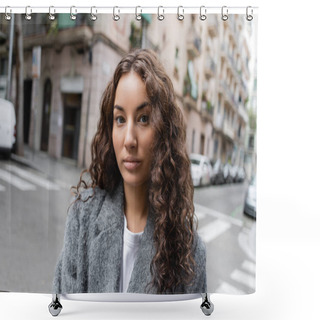 Personality  Portrait Of Young And Curly Brunette Woman In Casual Grey Jacket Standing On Blurred Urban Street With Buildings At Background At Daytime In Barcelona, Spain  Shower Curtains