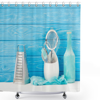Personality  Closeup View Of Rag, Bottle, Pastry Brush, Grater, Whisks And Sieve In Front Of Blue Wooden Wall Shower Curtains