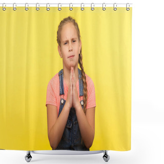 Personality  Ask Permission. Portrait Of Imploring Little Girl In Denim Overalls Holding Hands In Prayer Gesture And Pleading Forgiveness, Apologizing For Bad Behavior. Studio Shot Isolated On Yellow Background Shower Curtains