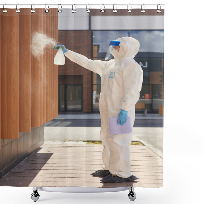 Personality  Side View Full Length Portrait Of One Worker Spraying Chemicals Over Building Outdoors During Disinfection Or Cleaning Shower Curtains