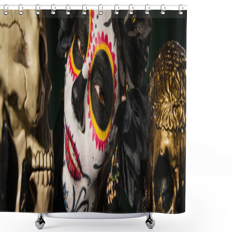 Personality  Portrait of woman in santa muerte makeup and black wreath looking at camera near skulls isolated on black, banner  shower curtains
