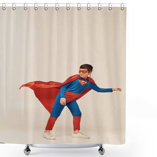 Personality  Full Length Of Happy Asian Boy In Superhero Costume With Cloak And Mask Smiling While Looking Away And Standing Against Wind During International Children's Day Holiday On Grey Background  Shower Curtains