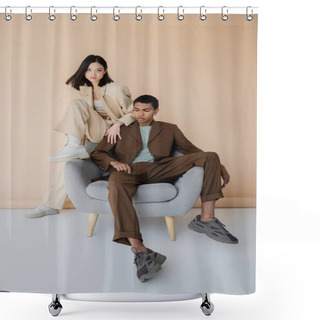 Personality  Full Length Of Young Interracial Couple In Fashionable Pantsuits Posing On Armchair On Beige Background Shower Curtains