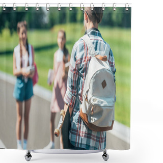 Personality  Back View Of Teenage Boy With Backpack Holding Skateboard And Looking At Friends In Park Shower Curtains