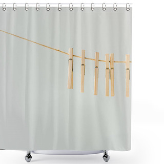Personality  Close Up Of Raw Of Wooden Clothespins Hanging On Clothesline Isolated On Grey Shower Curtains