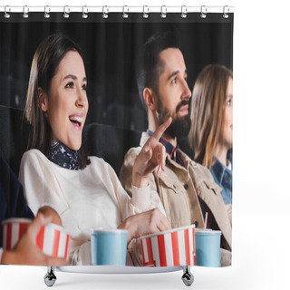 Personality  Selective Focus Of Smiling Woman Pointing With Finger And Watching Movie With Friends In Cinema  Shower Curtains