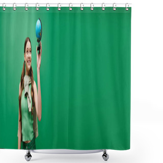 Personality  A Young, Beautiful Woman In Her 20s Holding A Vibrant Blue Globe With Curiosity And Wonder In A Studio Setting On A Green Backdrop. Shower Curtains