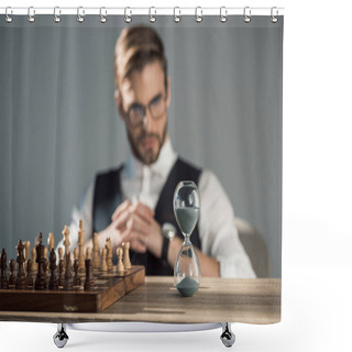 Personality  Close-up View Of Chess Board With Pieces And Sand Clock On Table And Businessman Sitting Behind Shower Curtains