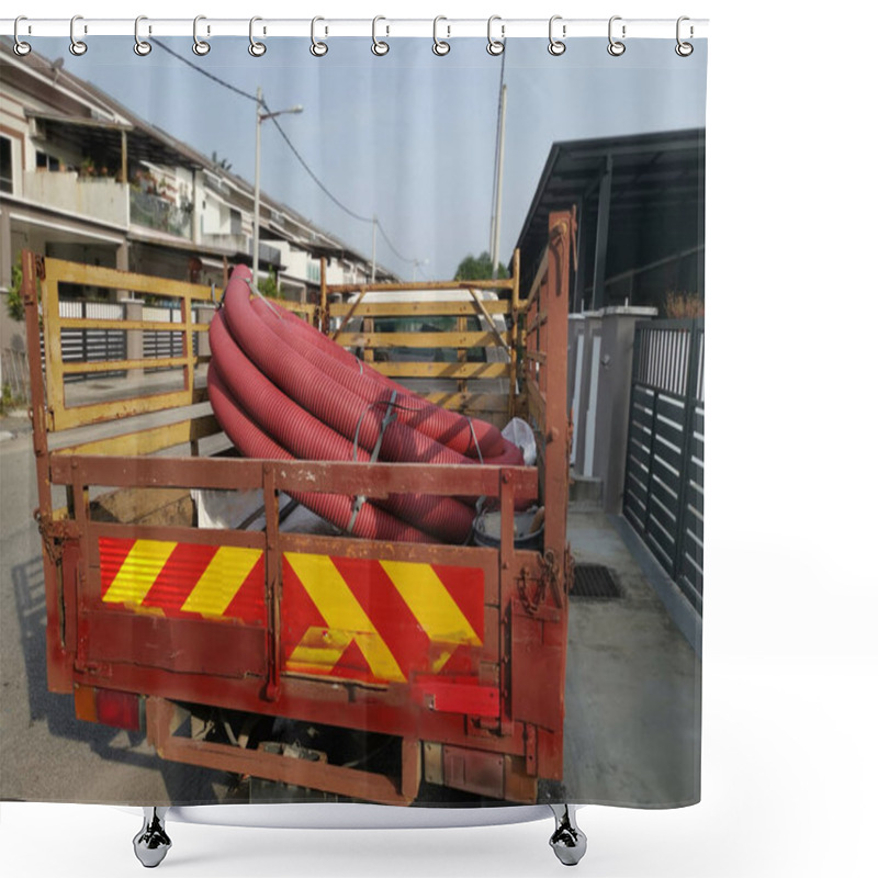 Personality  bundle of vermilion red PVC plastic industrial pipe hose at the back of the trunk. shower curtains