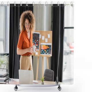Personality  Cheerful Businesswoman In Glasses Holding Cup And Looking At Laptop Near Office Board With Infographics  Shower Curtains
