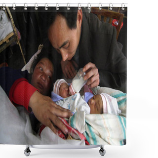 Personality  The Father Of A Pair Of Two-day-old Conjoined Twin Girls Feeds Them At A Hospital In Xinhua County, Loudi City, Central Chinas Hunan Province, March 18, 2009 Shower Curtains