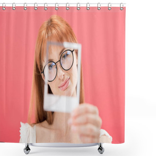 Personality  KYIV, UKRAINE - MAY 23, 2019: Selective Focus Of Attractive Redhead Girl In Glasses Holding Vintage Camera Frame Isolated On Pink Shower Curtains