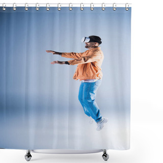 Personality  A Man In A VR Headset Jumps Energetically In A Studio Setting, Showcasing His Acrobatic Skills While Wearing A Stylish Hat. Shower Curtains
