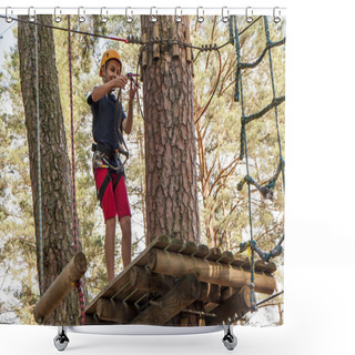 Personality  A Boy Wearing A Safety Harness And A Helmet Walking In A Rope Park. Shower Curtains