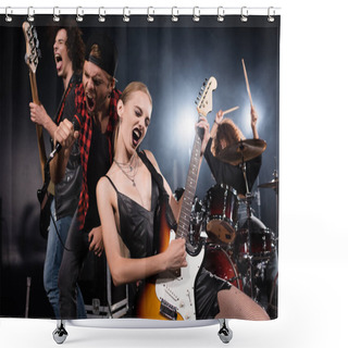 Personality  KYIV, UKRAINE - AUGUST 25, 2020: Blonde Woman Playing Electric Guitar While Shouting With Vocalist And Guitarist With Female Drummer On Blurred Background Shower Curtains