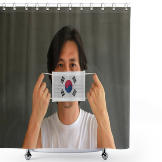 Personality  A Man With South Korea Flag On Hygienic Mask In His Hand And Lifted Up The Front Face On Dark Grey Background. Tiny Particle Or Virus Corona Or Covid 19 Protection. Concept Of Combating Illness. Shower Curtains