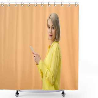 Personality  Pretty Blonde Woman In Yellow Shirt Holding Smartphone And Looking At Camera Isolated On Orange Shower Curtains