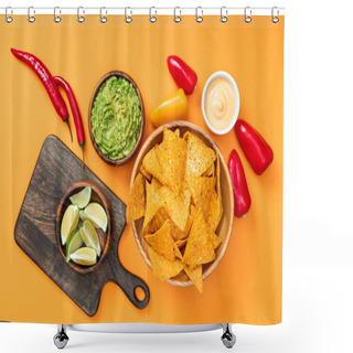 Personality  Top View Of Crispy Mexican Nachos, Guacamole, Peppers, Limes, Cheese Sauce And Wooden Cutting Board On Orange Background Shower Curtains