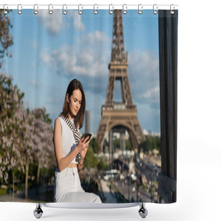 Personality  Young Woman In Stylish Outfit Using Smartphone While Sitting Near Eiffel Tower In Paris  Shower Curtains
