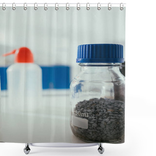 Personality  Selective Focus Of Glass Jar With Gravel Near Plastic Container On Desk In Laboratory Shower Curtains