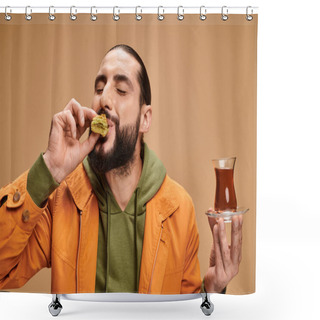 Personality  Happy Bearded Man Holding Turkish Tea In Traditional Glass Cup And Eating Tasty Baklava On Beige Shower Curtains