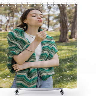 Personality  Young Woman With Knitted Sweater On Shoulders Blowing On Daisy In Summer Park  Shower Curtains
