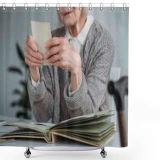 Personality  Partial View Of Senior Woman Looking At Photo From Photo Album At Table At Home Shower Curtains